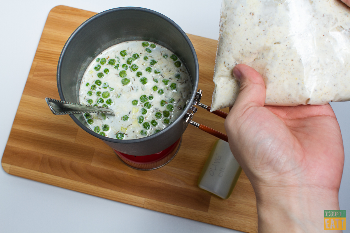 backpacking chicken and dumplings in a pot with water