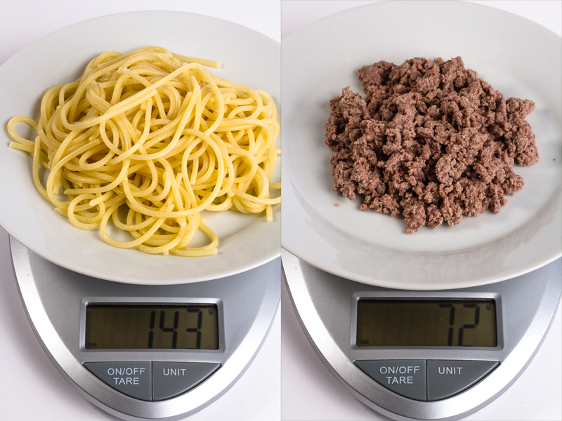 cooked spaghetti noodles and ground beef on scale