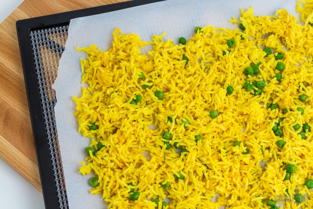 Dehydrating basmati rice is simple golden basmati rice on a dehydrator tray
