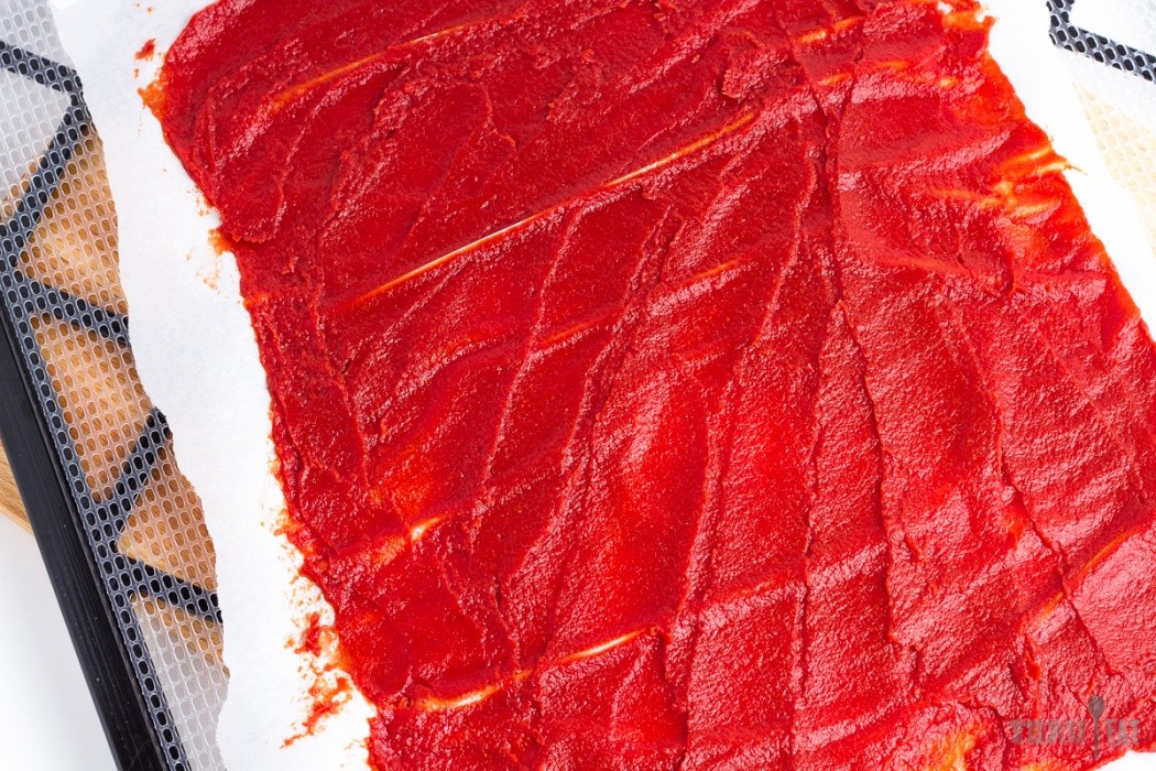 Spread the tomato paste as thinly and evenly as possible tomato paste spread on a dehydrator tray