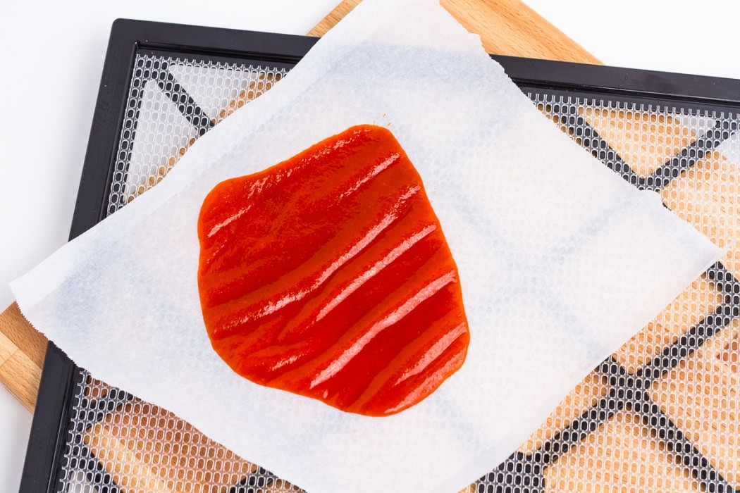 Sriracha spread on a dehydrator tray