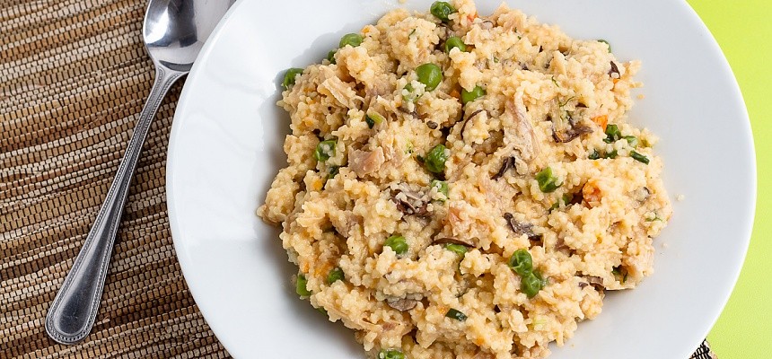 plated cheesy chicken couscous with mushrooms, peas, and carrots