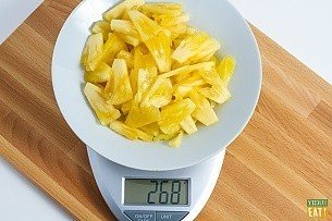 sliced pineapple on a food scale