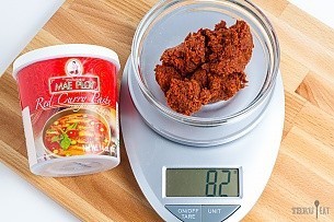 82 grams of red curry paste on a scale