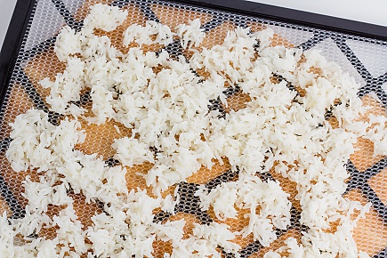 jasmine rice spread on an Excalibur dehydrator tray