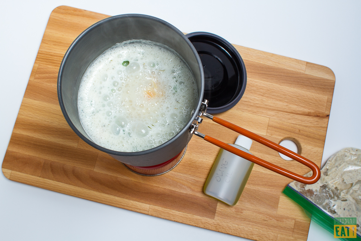 dehydrated backpacking chicken and dumplings simmering in a pot